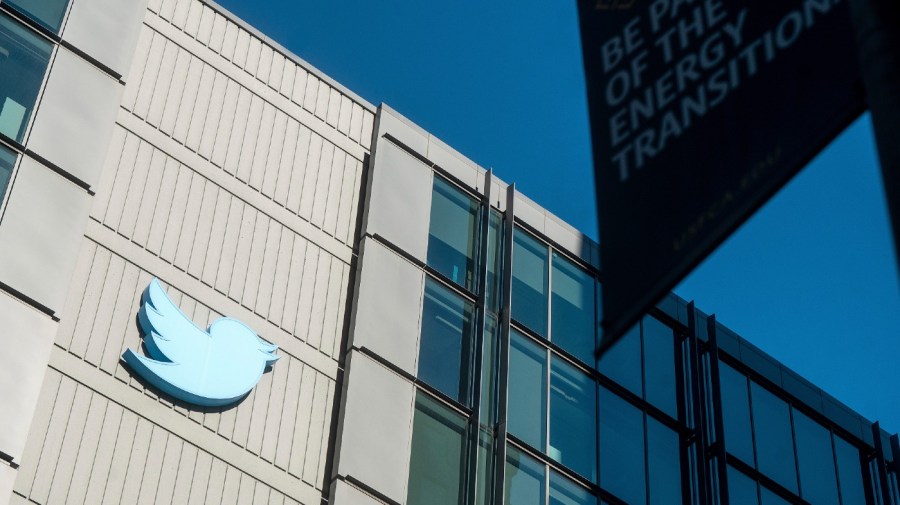 FILE - A Twitter logo hangs outside the company's San Francisco offices on Tuesday, Nov. 1, 2022.