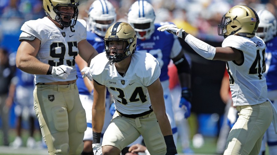 File - Army linebacker Andre Carter II (34) celebrates a sack during the first quarter of an NCAA football game Saturday, Sept. 4, 2021, in Atlanta.