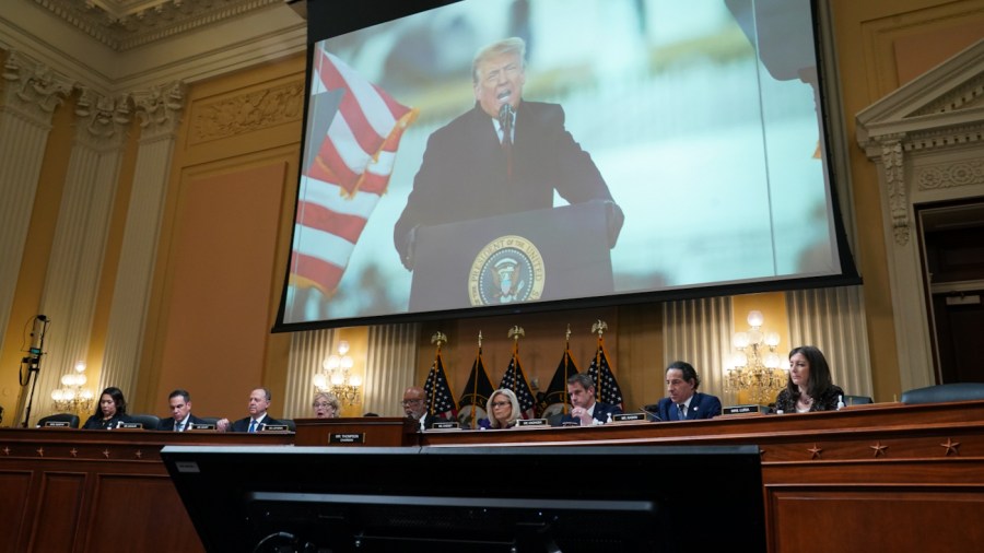 An image of former President Trump speaking on Jan. 6, 2021 is displayed at the final public meeting of the select House committee investigating the attack on the U.S. Capitol.