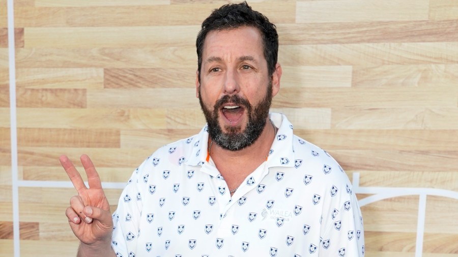 Adam Sandler poses at the premiere of the Netflix film “Hustle”