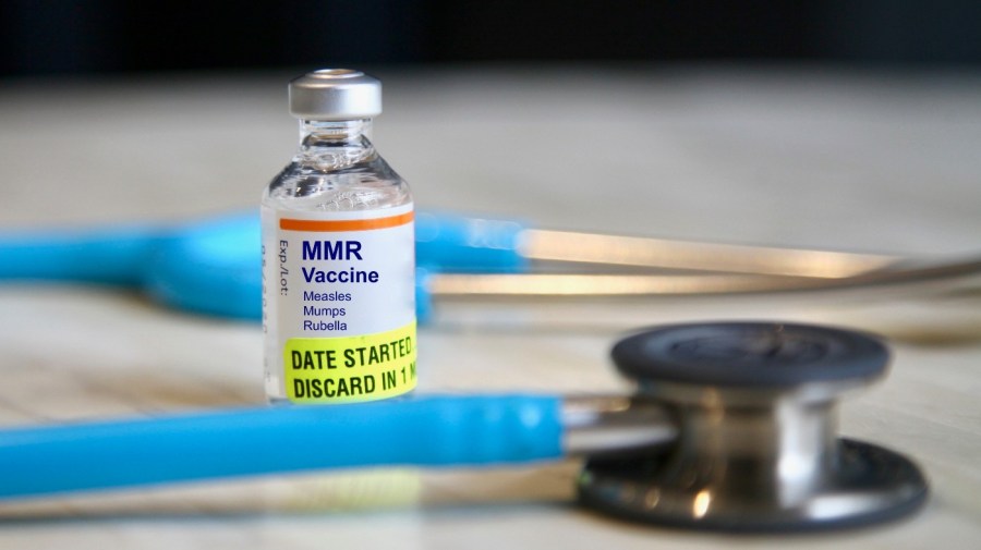 vaccine vial of measles mumps rubella vaccine and a stethoscope