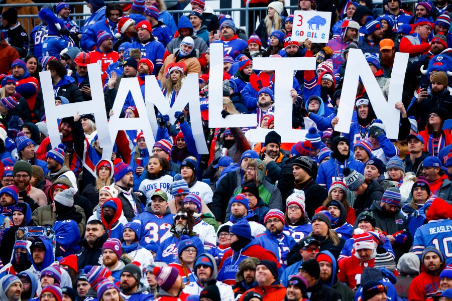 Fans hold a sign in support of Buffalo Bills safety Damar Hamlin