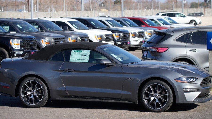 File - Unsold 2022 Mustang convertible sits Thursday, Nov. 25, 2022, outside a Ford dealership in southeast Denver.