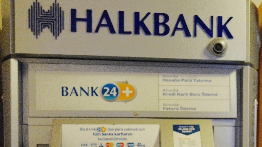 FILE - This Oct, 16, 2019, file photo, shows a Halkbank bank ATM at the Parliament in Ankara, Turkey. (AP Photo/Burhan Ozbilici, File)