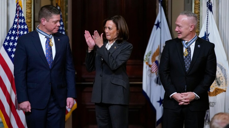 Vice President Kamala Harris applauds after presenting the Congressional Space Medal of Honor to former NASA astronauts Robert Behnken, left, and Douglas Hurley in the Indian Treaty Room in the Eisenhower Executive Office Building on the White House Campus in Washington, Tuesday, Jan. 31, 2023. Behnken and Hurley were honored for piloting the inaugural NASA SpaceX Demonstration Demo-2 mission to the International Space Station in 2020. (AP Photo/Patrick Semansky)