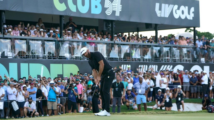 Dustin Johnson putts on the 18th green during the final round of the LIV Golf Team Championship