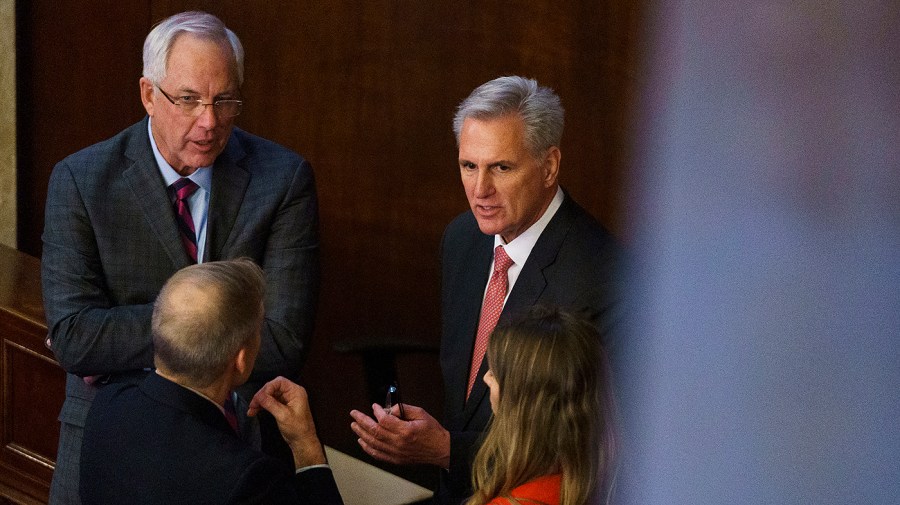 Rep. Jim Jordan (R-Ohio) speaks with Rep. Kevin McCarthy (R-Calif.) and his chief of staff Dan Meyer, left,