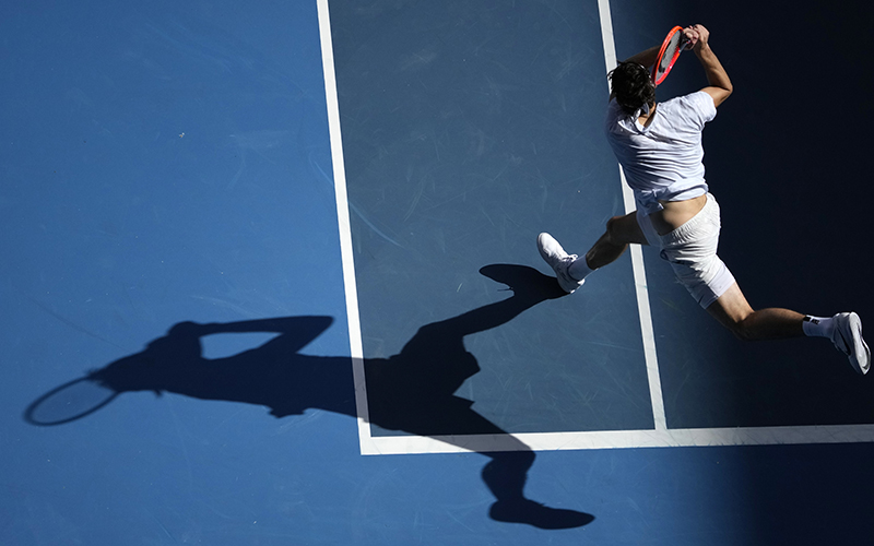 Taylor Fritz of the U.S. plays a backhand return at the Australian Open tennis championship