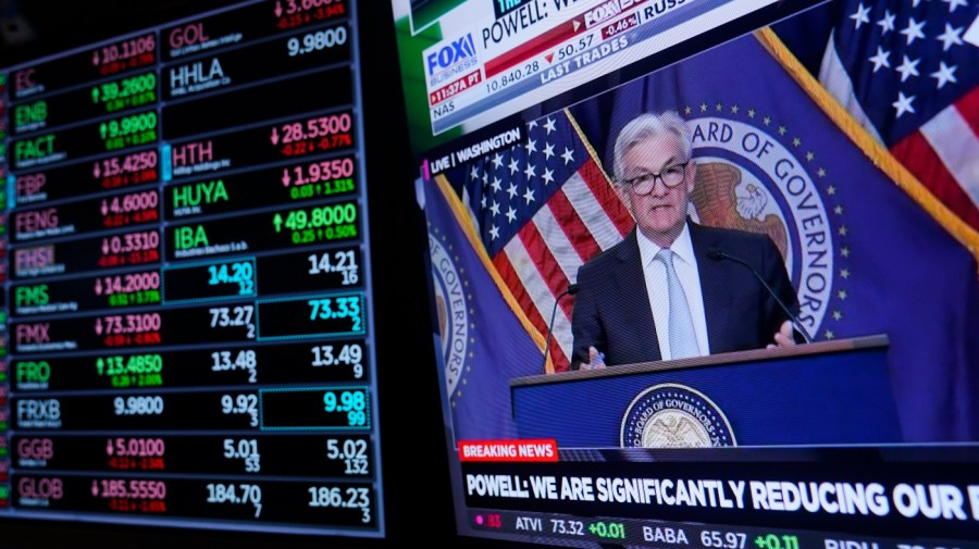 FILE - Federal Reserve chairman Jerome Powell appears on a monitor on the floor of the New York Stock Exchange in New York, Wednesday, Nov. 2, 2022. The Federal Reserve is poised this week to raise its benchmark interest rate for an eighth time since March. (AP Photo/Seth Wenig, File)