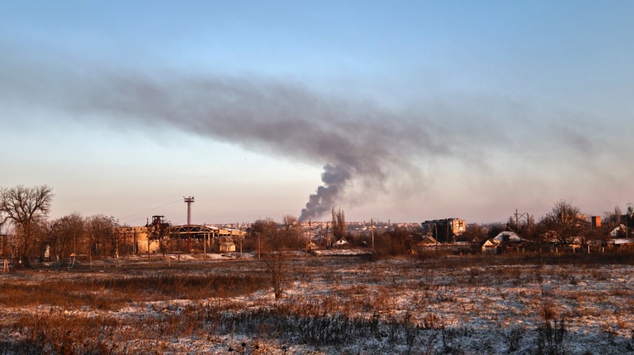 Smoke rises after shelling in Soledar, the site of heavy battles with Russian forces in the Donetsk region, Ukraine, Sunday, Jan. 8, 2023. (AP Photo/Roman Chop)