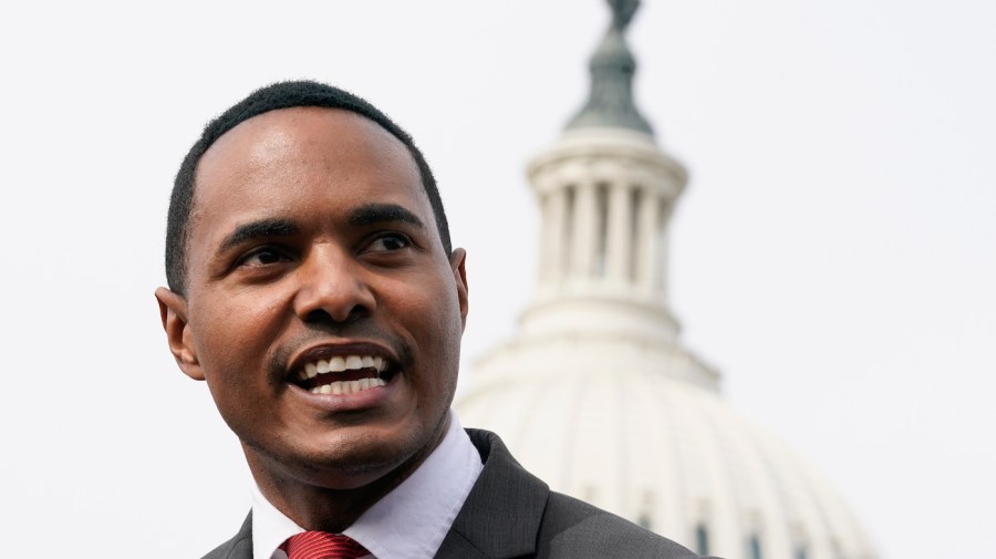 Representative Ritchie Torres is seen with the Capitol in view behind him.