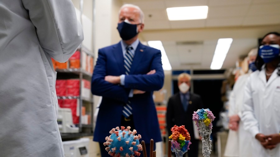 FILE - In this Thursday, Feb. 11, 2021 file photo, President Joe Biden visits the Viral Pathogenesis Laboratory at the National Institutes of Health (NIH) in Bethesda, Md. (AP Photo/Evan Vucci)