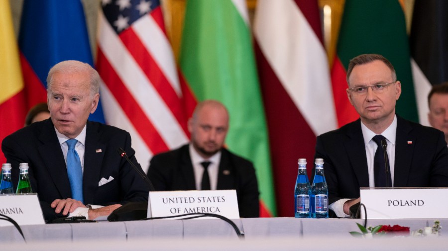 Polish President Andrzej Duda listens as President Biden speaks