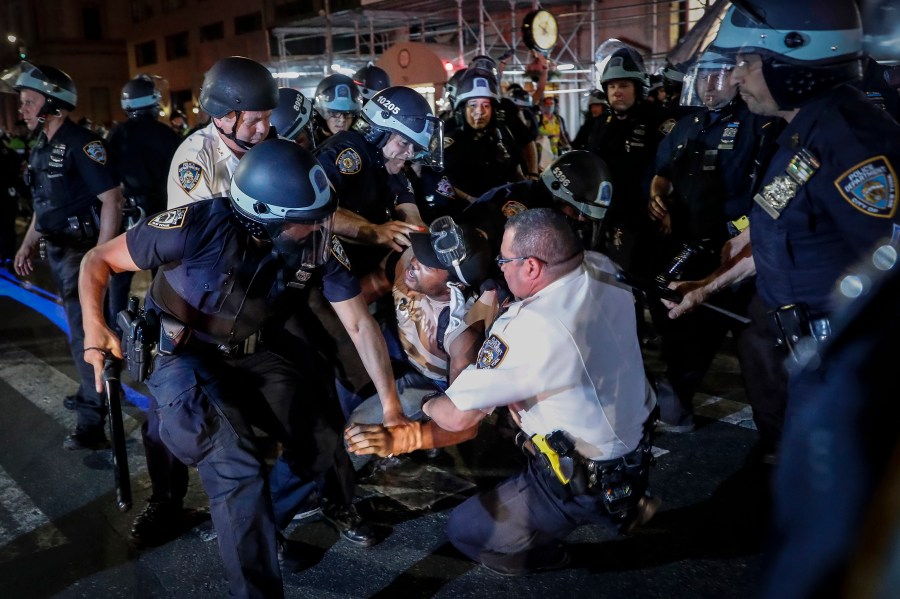 A protester is arrested on New York's Fifth Avenue