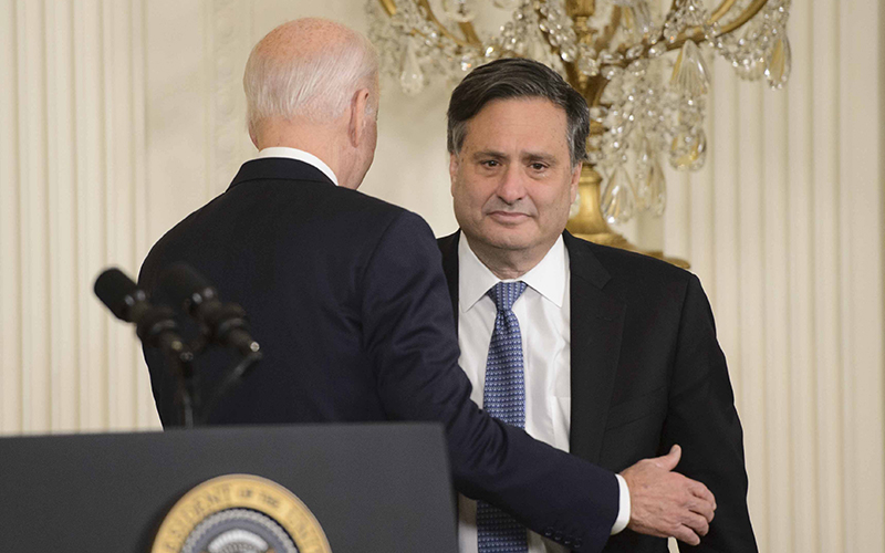 President Biden embraces chief of staff Ron Klain during an official transition event