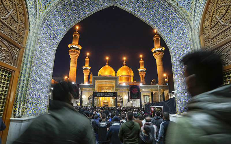 Shiite worshippers gather at the golden-domed shrine of Imam Moussa al-Kadhim