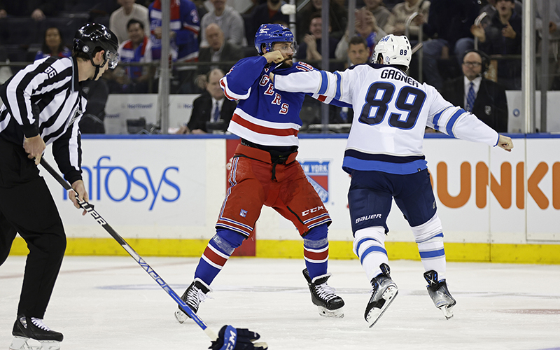 New York Rangers center Vincent Trocheck fights with Winnipeg Jets center Sam Gagner