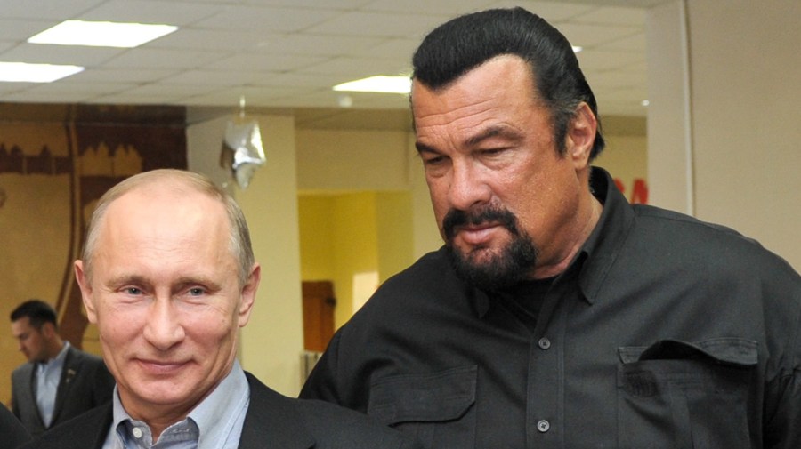 FILE - In this file photo taken on Wednesday, March 13, 2013, Russian President Vladimir Putin, left, and U.S. movie actor Steven Seagal visit a new sports arena in Moscow, Russia.