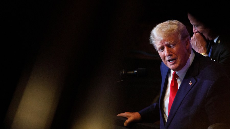 Former President Trump addresses the crowd at a campaign event.