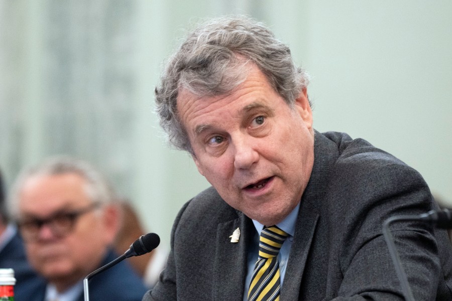 Senator Sherrod Brown looks to the side while speaking at a congressional hearing.