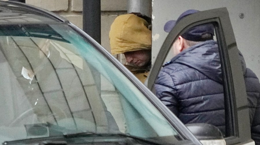 Wall Street Journal reporter Evan Gershkovich is escorted by officers from the Lefortovsky court to a bus, in Moscow, Russia, Thursday, March 30, 2023. Russia's top security agency says an American reporter for the Wall Street Journal has been arrested on espionage charges. The Federal Security Service said Thursday that Evan Gershkovich was detained in the Ural Mountains city of Yekaterinburg while allegedly trying to obtain classified information.