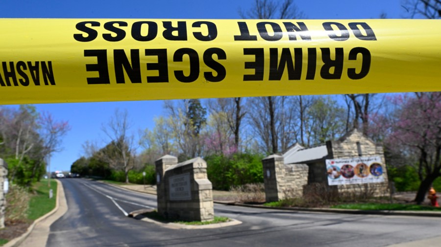 Police tape in front of school entrance