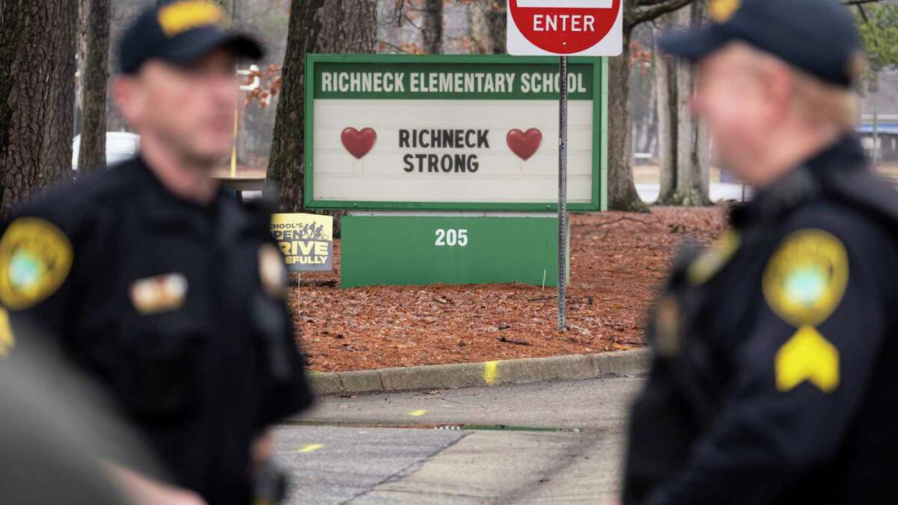 Police look on as students return to Richneck Elementary