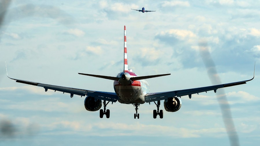 An American Airlines plane lands at Reagan National Airport in Arlington, Va.,