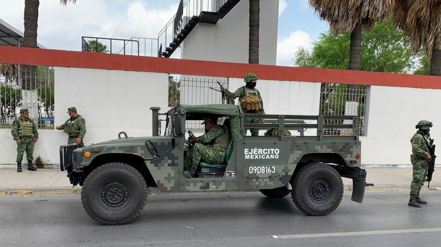 Mexican army soldiers prepare a search mission