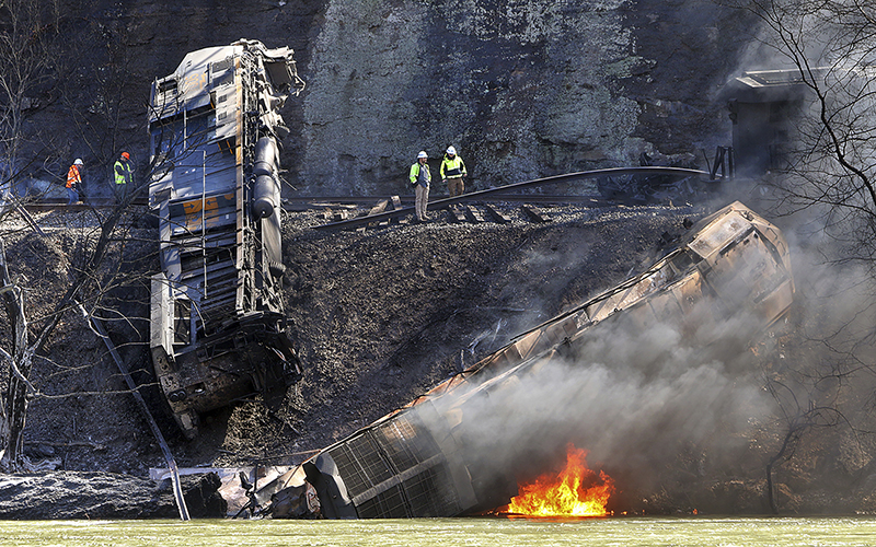 Smoke fills the sky after an empty CSX coal train hit a rockslide along tracks