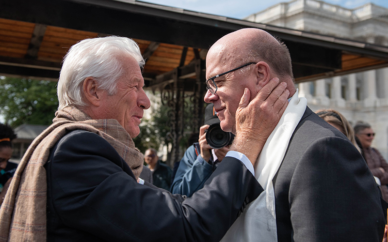 Actor Richard Gere and Rep. Jim McGovern (D-Mass.) embrace before a press conference