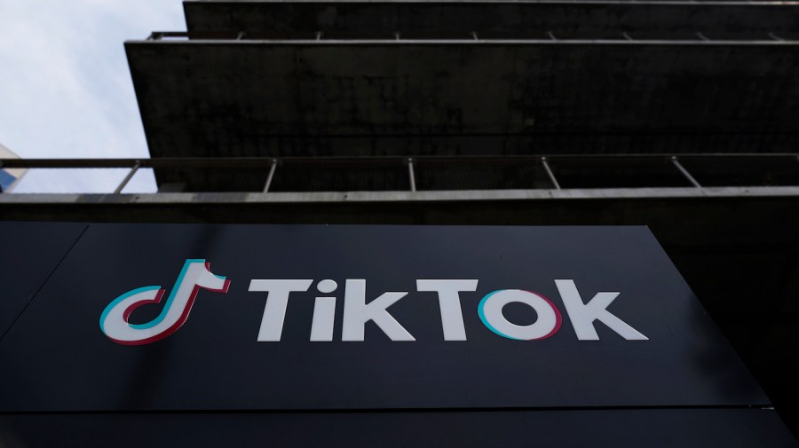 The TikTok logo is seen on the side of a building.