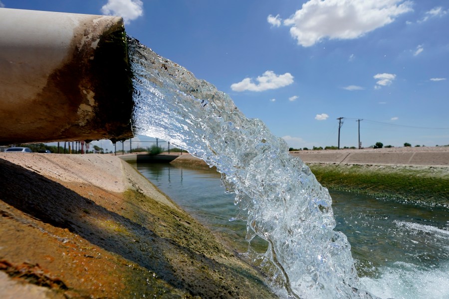 Water from the Colorado River diverted through the Central Arizona Project fills an irrigation canal, Thursday, Aug. 18, 2022, in Maricopa, Ariz.