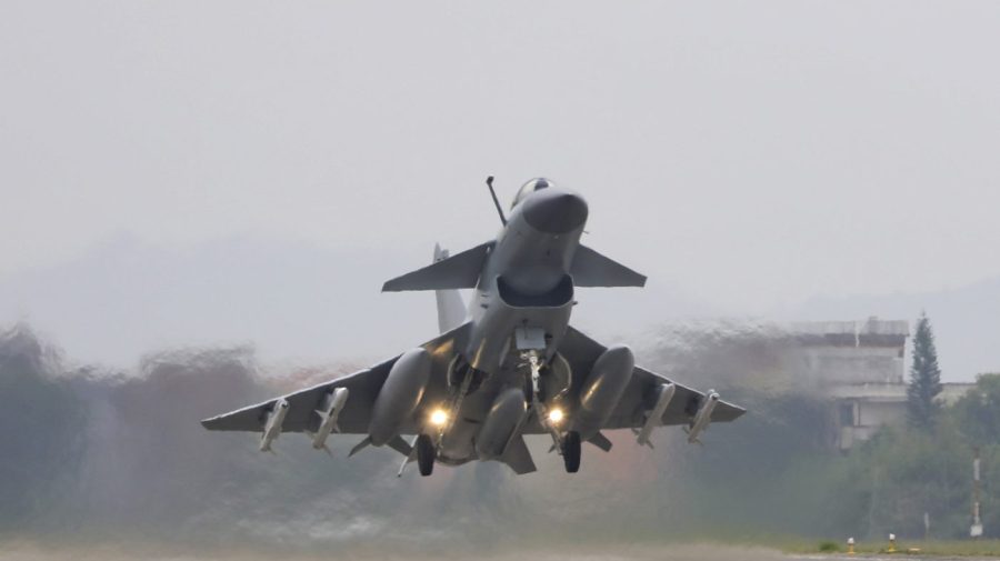 In this photo released by Xinhua News Agency, a fighter takes off during the combat readiness patrol and military exercises around the Taiwan Island carried out by the Eastern Theater Command of the Chinese People's Liberation Army (PLA) from Nanjing in eastern China on April 8, 2023. Recent Chinese air and sea drills simulating an encirclement of Taiwan were intended as a "serious warning" to pro-independence politicians on the self-governing island and their foreign supporters, a Chinese spokesperson said Wednesday, April 12, 2023. (Wang Zixiao/Xinhua via AP)