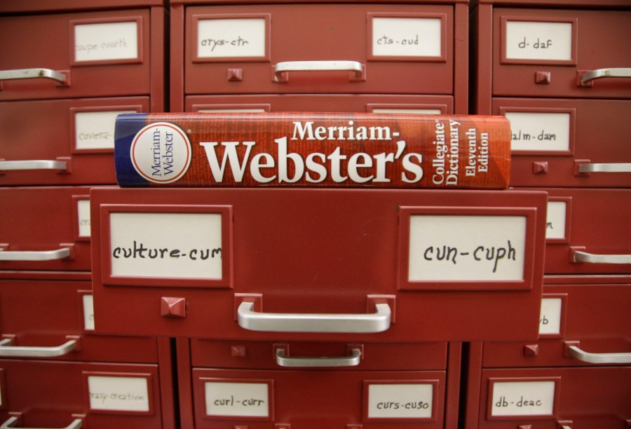 FILE - A Merriam-Webster dictionary sits atop their citation files at the dictionary publisher's offices on Dec. 9, 2014, in Springfield, Mass. A California man who admitted to making violent anti-LGBTQ threats against dictionary publisher Merriam-Webster Inc. over its updated gender definitions was sentenced in a federal courtroom in Massachusetts on Thursday, April 13, 2023, to a year in prison. (AP Photo/Stephan Savoia, File)