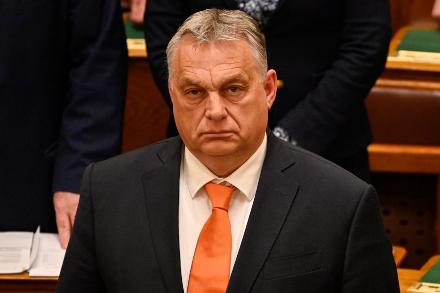 FILE - Hungary's Prime Minister Viktor Orban stands after a vote on Finland's bid to join NATO, at the parliament in Budapest, Hungary, on March 27, 2023. Hungary's prime minister sought to bring down the temperature on spiraling tensions between his government and the United States, declaring Friday, April 14, 2023 that the U.S. is Hungary's “friend” despite sanctions Washington imposed on a Budapest-based Russian bank. (AP Photo/Denes Erdos, File)