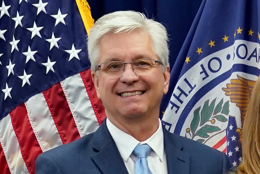 FILE - Federal Reserve Board of Governors member Christopher Waller poses for a photo on May 23, 2022, in Washington. Waller said Friday, April 14, 2023, that there has been little progress on inflation for more than a year and that more interest rate hikes are needed to get prices under control. (AP Photo/Patrick Semansky, File)