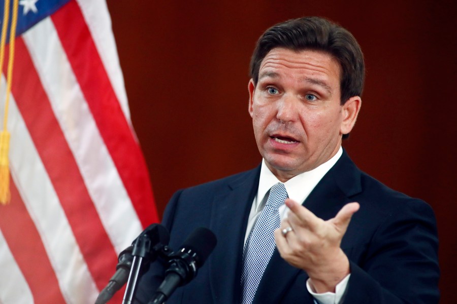 FILE - Florida Gov. Ron DeSantis answers questions from the media in the Florida Cabinet following his State of the State address during a joint session of the Senate and House of Representatives on March 7, 2023, at the state Capitol in Tallahassee, Fla. The Republican-dominated Florida Legislature on Thursday, April 13, approved a ban on abortions after six weeks of pregnancy, a proposal supported by DeSantis as he prepares for an expected presidential run. (AP Photo/Phil Sears, File)