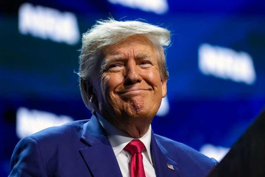 Former President Donald Trump speaks at the National Rifle Association Convention in Indianapolis, Friday, April 14, 2023. (AP Photo/Michael Conroy)