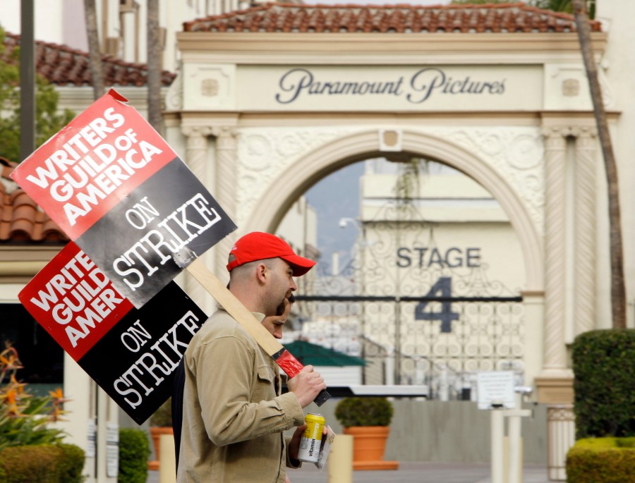 FILE - Striking film and television writers picket outside Paramount Studios on Jan. 23, 2008, in Los Angeles. In an email to members Monday, April 17, 2023, leaders of the Writers Guild of America said nearly 98% of voters said yes to a strike authorization if a new contract agreement is not reached with producers. The guild last went on strike in 2007. (AP Photo/Kevork Djansezian, File)