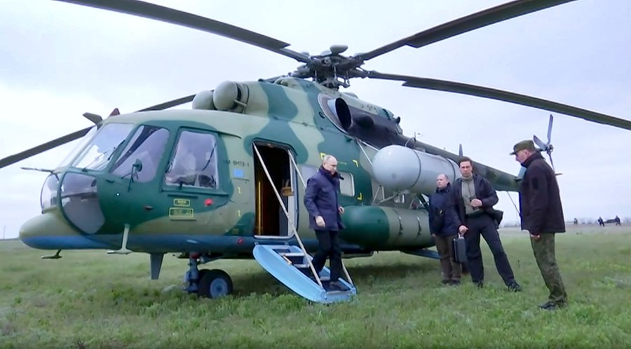 In this photo taken from video released by Russian TV Pool on Tuesday, April 18, 2023, Russian President Vladimir Putin arrives at an undisclosed location. The Kremlin says Putin has visited headquarters of the Russian troops fighting in Ukraine. (Pool Photo via AP)