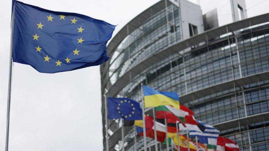 The European flag, left, flies Tuesday, April 18, 2023 at the European Parliament in Strasbourg, eastern France. (AP Photo/Jean-Francois Badias)