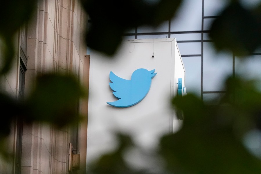 FILE - A sign at Twitter headquarters is shown in San Francisco, Dec. 8, 2022. Twitter has quietly removed a policy against the “targeted misgendering or deadnaming of transgender individuals,” raising concerns that the Elon Musk-owned platform is becoming less safe for marginalized groups. (AP Photo/Jeff Chiu, File)