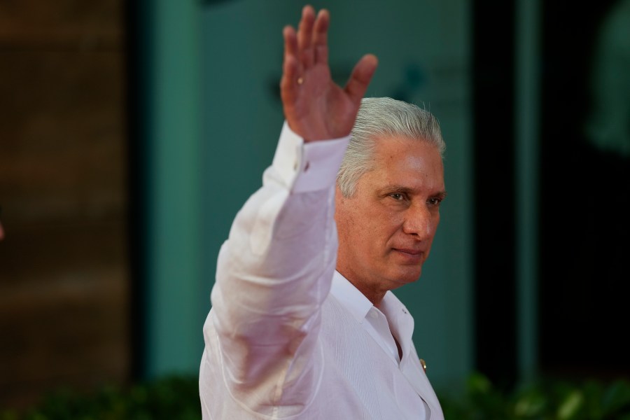 Cuba's President Miguel Diaz-Canel waves as he arrives for a session during the 28th Ibero-American Summit in Santo Domingo, Dominican Republic, March 25, 2023.