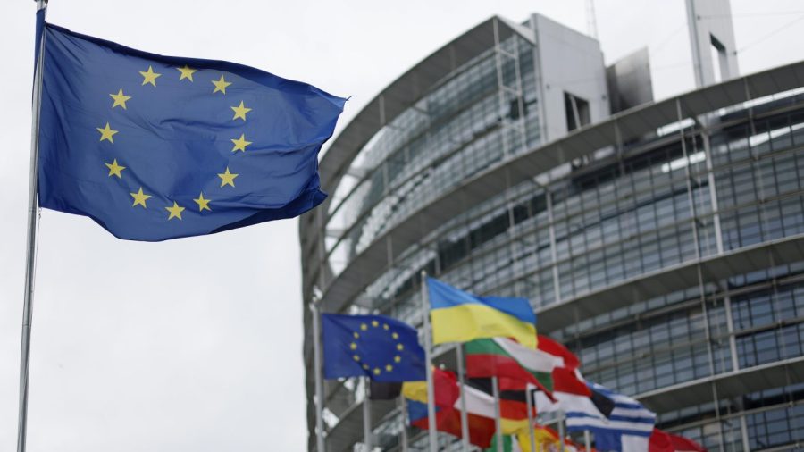 The European flag, left, flies Tuesday, April 18, 2023 at the European Parliament in Strasbourg, eastern France. (AP Photo/Jean-Francois Badias)