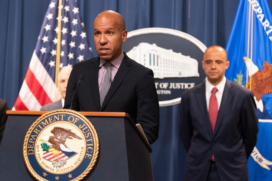 Under Secretary of the Treasury for Terrorism and Financial Intelligence Brian Nelson with U.S. Attorney Matthew Graves for the District of Columbia, speaks during a news conference, Tuesday, April 25, 2023, at the Department of Justice in Washington. The Justice Department says British American Tobacco has agreed to a $629 million settlement to resolve allegations that it did illegal business with North Korea. In addition, federal prosecutors disclosed a cigarette trafficking scheme that raised money for North Korea's nuclear weapons program, announcing charges against three men — a North Korean banker and two Chinese facilitators. (AP Photo/Manuel Balce Ceneta)