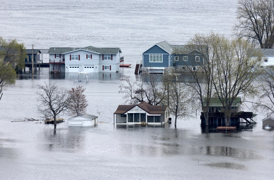 The flooded Mississippi River surrounds the homes on Abel Island near Guttenberg, Iowa, on Tuesday, April 25, 2023. (Stephen Gassman/Telegraph Herald via AP)