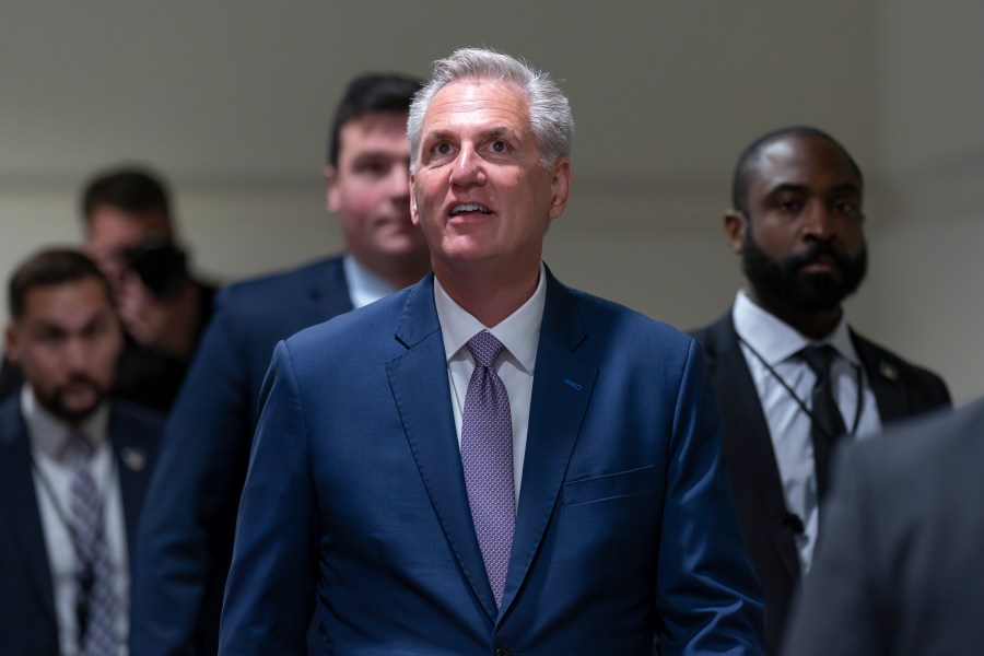 Speaker of the House Kevin McCarthy, R-Calif., arrives for a closed-door meeting with fellow Republicans as he pushes his sweeping debt ceiling package, at the Capitol in Washington, Wednesday, April 26, 2023. McCarthy is struggling to round up the votes for the bill, which would couple an increase of the country's debt ceiling with restrictions on federal spending. A final vote on the package is likely Thursday. (AP Photo/J. Scott Applewhite)