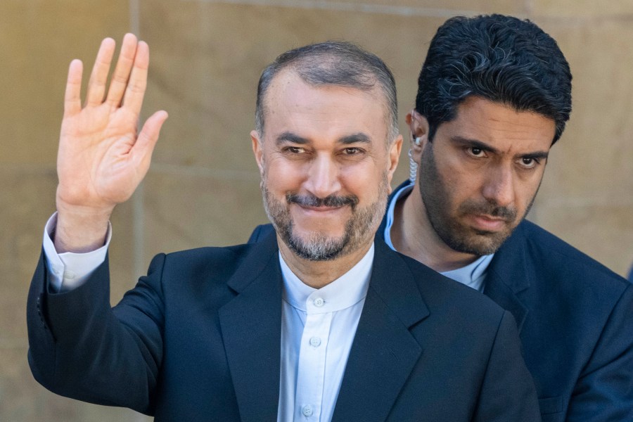 Iranian Foreign Minister Hossein Amirabdollahian waves for cameras after a joint press conference with his Lebanese counterpart Abdallah Bouhabib in Beirut, Lebanon, Thursday, April 27, 2023. (AP Photo/Hassan Ammar)