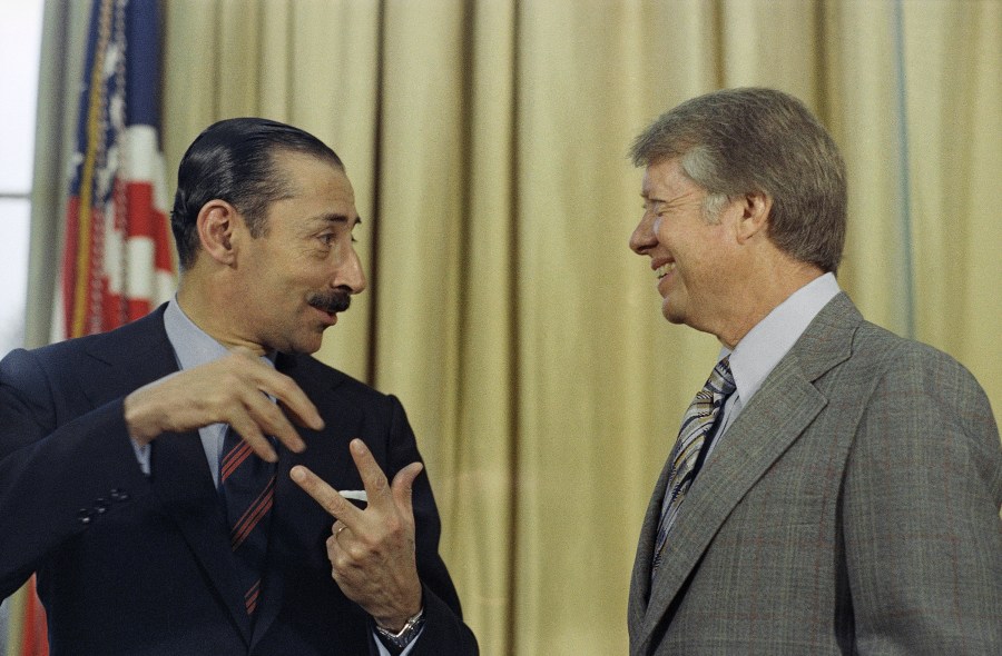 FILE - President Jimmy Carter with Jorge R. Videla, President of Argentina, at a meeting at the White House in Washington on Sept. 9, 1977. (AP Photo/Bob Daugherty, File)